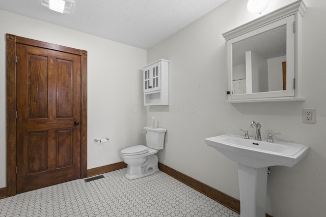 bathroom with sink and toilet