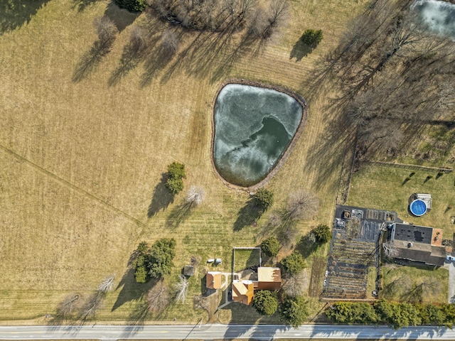 birds eye view of property with a rural view