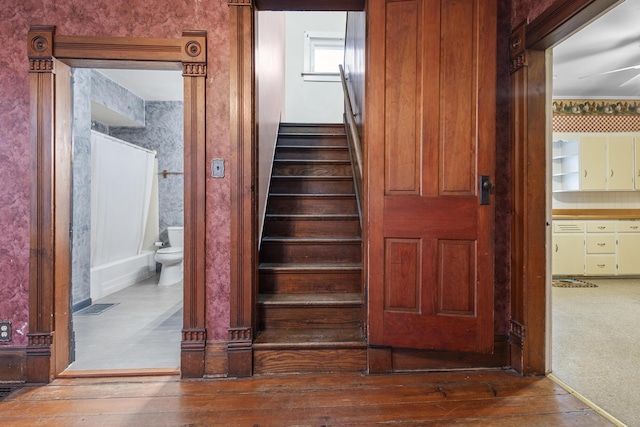 stairway featuring hardwood / wood-style flooring