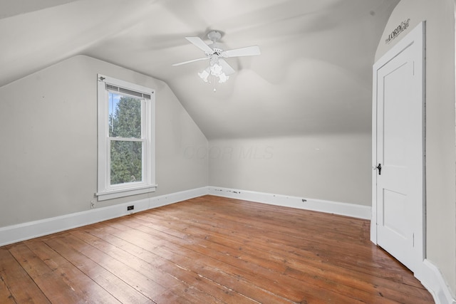 bonus room featuring wood-type flooring, lofted ceiling, and ceiling fan