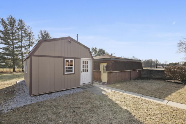 view of outdoor structure featuring a yard