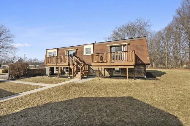 back of house with a wooden deck and a yard