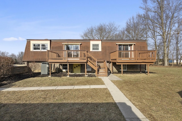 view of front of house featuring central AC unit, a deck, and a front yard