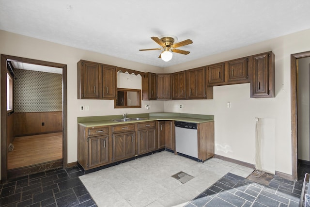 kitchen featuring dark brown cabinetry, sink, stainless steel dishwasher, and ceiling fan