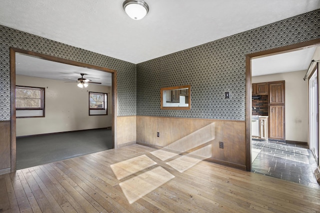 empty room featuring wood-type flooring and a textured ceiling