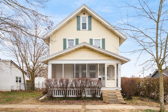 view of front of home with a sunroom