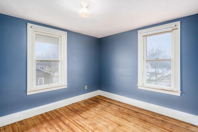 unfurnished room featuring light wood-type flooring