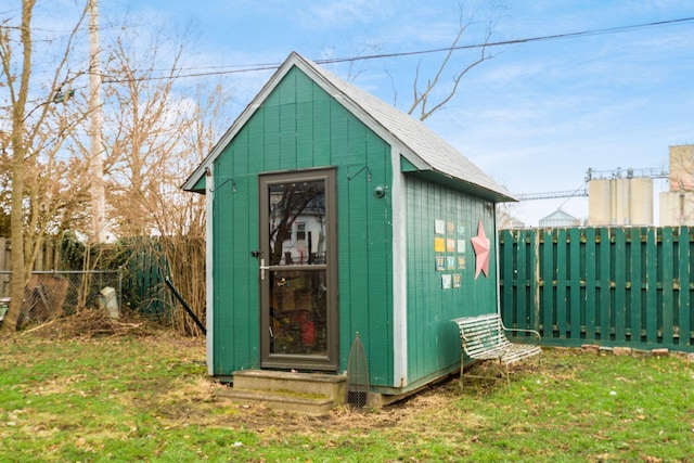 view of outdoor structure featuring a lawn