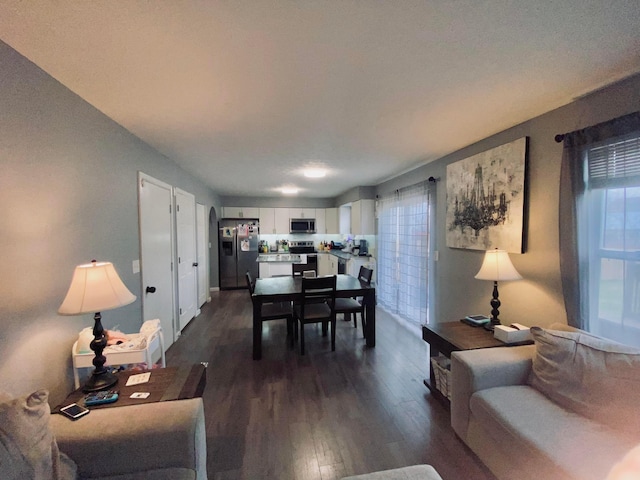 dining area with dark hardwood / wood-style floors