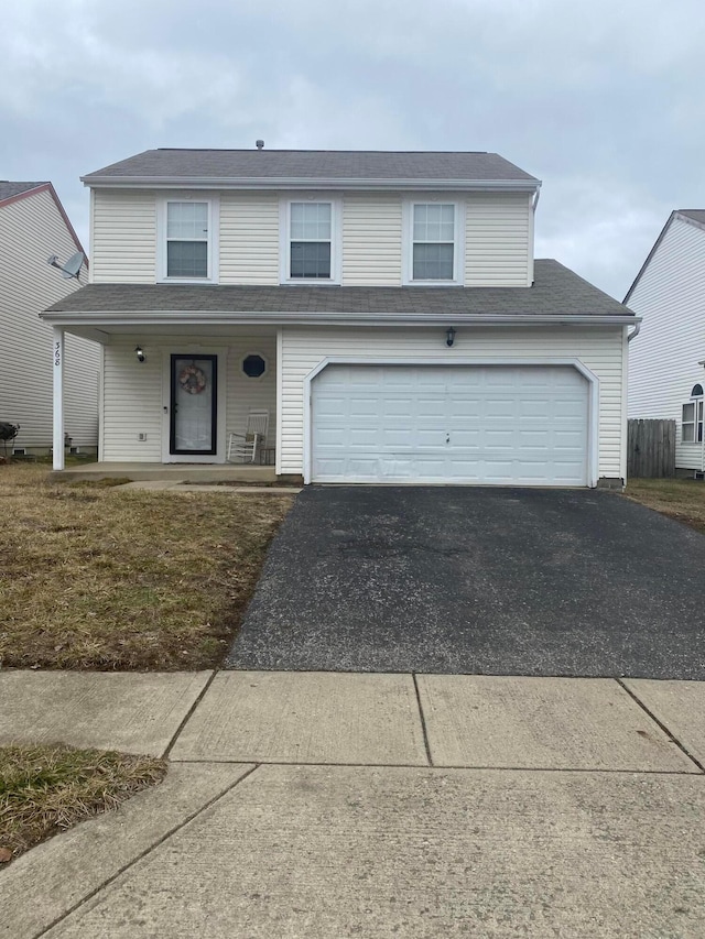 front of property with a garage and covered porch