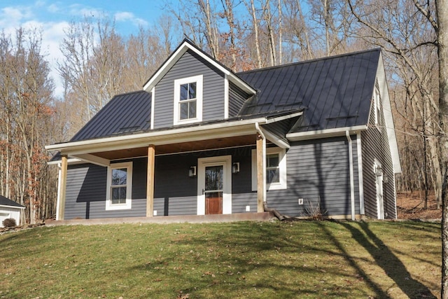 view of front of property featuring covered porch and a front yard