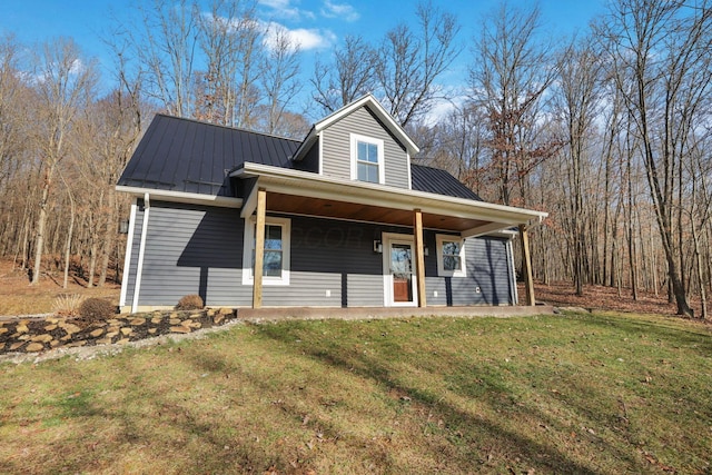 view of front of home featuring a front yard and covered porch