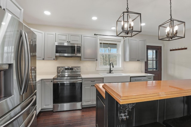 kitchen with sink, gray cabinets, and stainless steel appliances