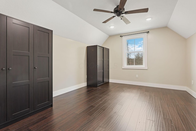 bonus room with vaulted ceiling, dark wood-type flooring, and ceiling fan