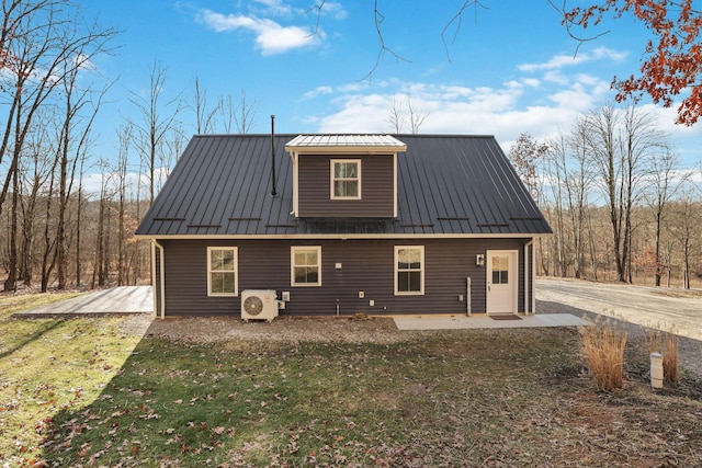 exterior space with a yard, a patio, and ac unit