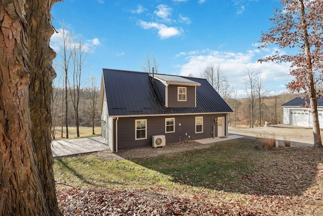 back of house with a garage