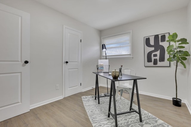 home office featuring light hardwood / wood-style floors