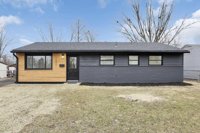 ranch-style home with a front yard