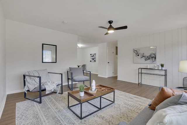 living room with hardwood / wood-style flooring and ceiling fan