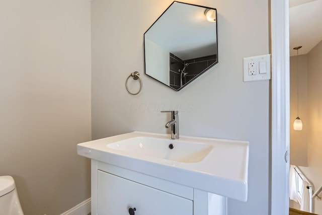 bathroom with vanity and toilet