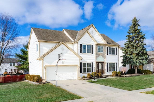 view of front of house with a garage and a front yard