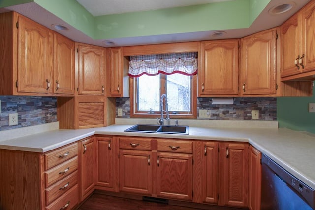 kitchen with dishwashing machine, sink, and decorative backsplash