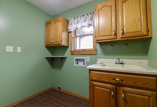 laundry room featuring cabinets, sink, washer hookup, and dark hardwood / wood-style floors