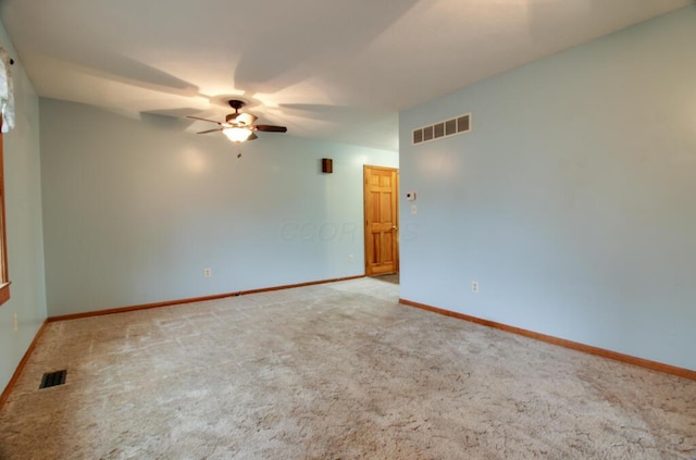 unfurnished room with light carpet and ceiling fan