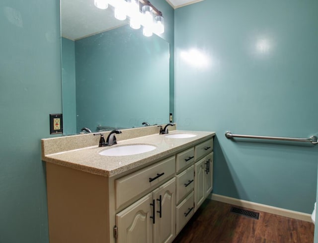 bathroom featuring vanity and hardwood / wood-style floors