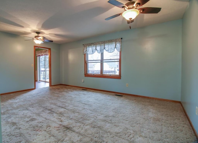 carpeted empty room with ceiling fan