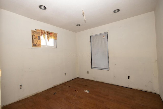 unfurnished room featuring dark hardwood / wood-style flooring