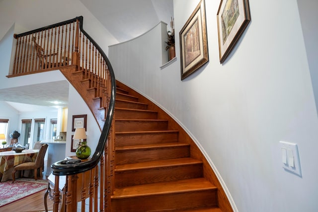 stairs with hardwood / wood-style floors