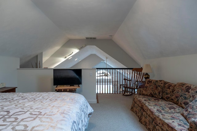 carpeted bedroom featuring lofted ceiling