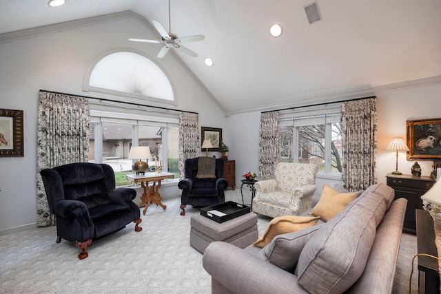 carpeted living room with ornamental molding, ceiling fan, and high vaulted ceiling