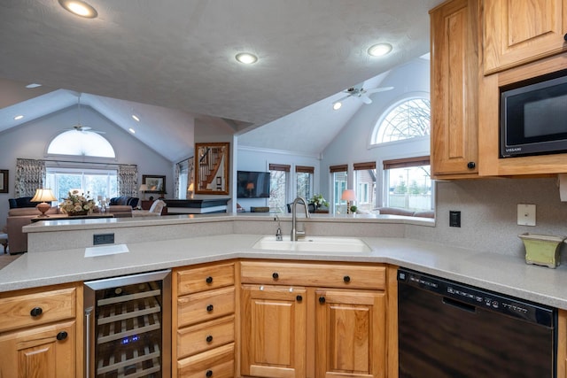 kitchen with sink, ceiling fan, wine cooler, black appliances, and vaulted ceiling