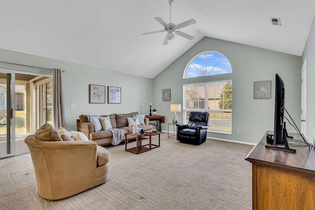 carpeted living area featuring baseboards, a ceiling fan, visible vents, and high vaulted ceiling