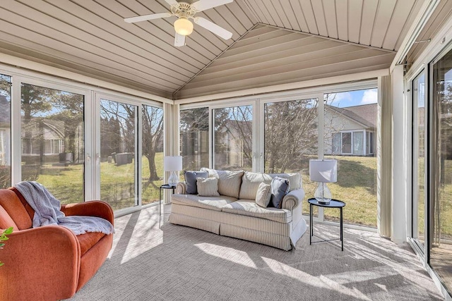 sunroom / solarium with wooden ceiling, lofted ceiling, and ceiling fan