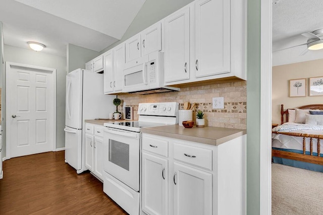 kitchen with light countertops, decorative backsplash, dark wood-style floors, white cabinets, and white appliances