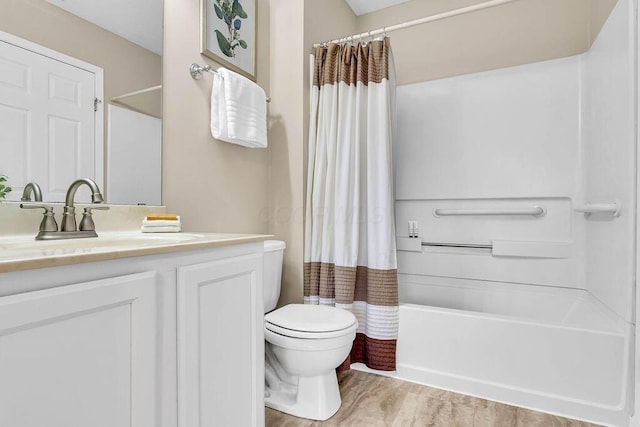 bathroom with vanity, shower / bath combination with curtain, and toilet