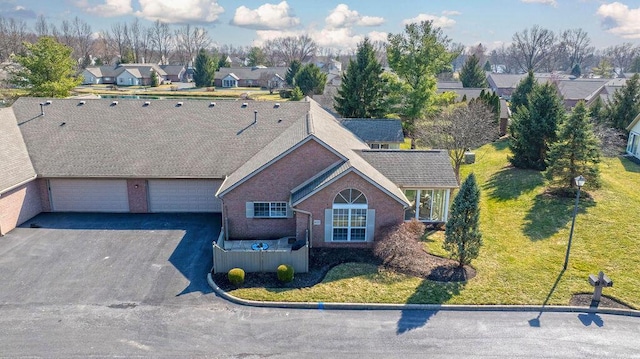 birds eye view of property with a residential view