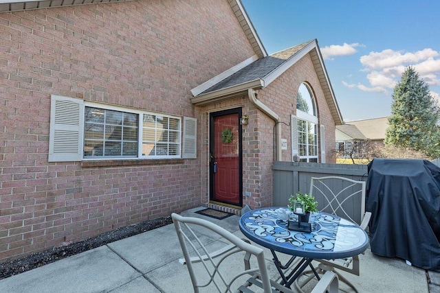 view of patio / terrace with area for grilling, outdoor dining area, and fence