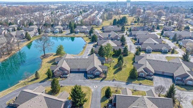 drone / aerial view featuring a residential view and a water view