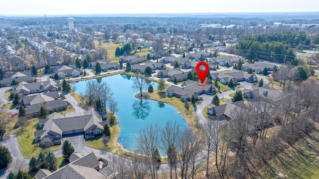 birds eye view of property with a residential view and a water view