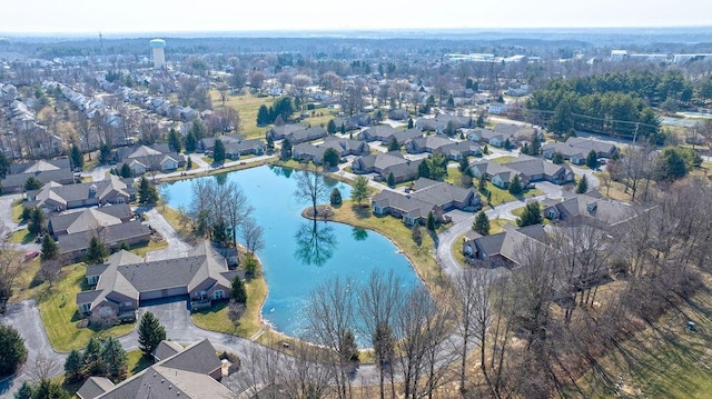 drone / aerial view featuring a residential view and a water view