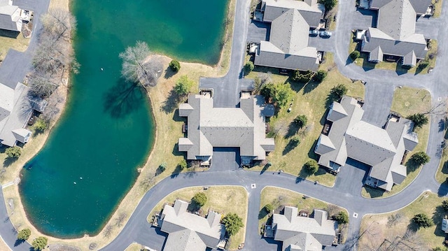 birds eye view of property with a residential view and a water view