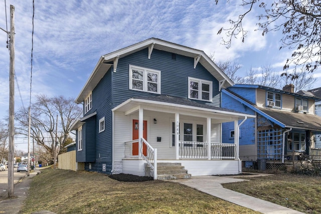 view of front of property featuring a porch and a front lawn