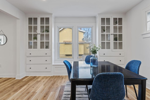 dining area featuring light wood-type flooring