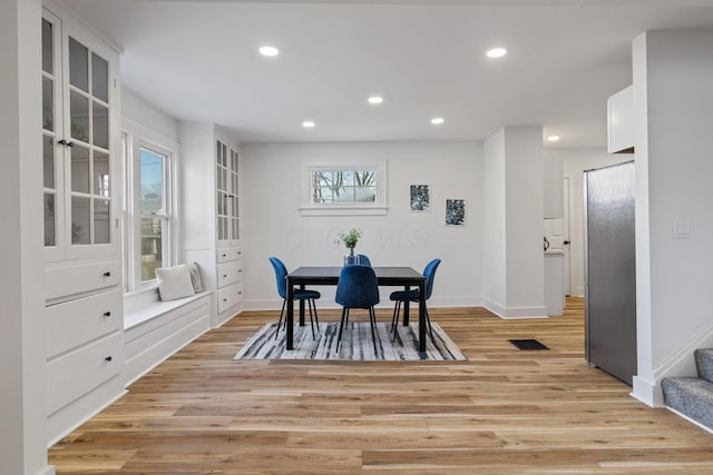 dining room with light hardwood / wood-style flooring