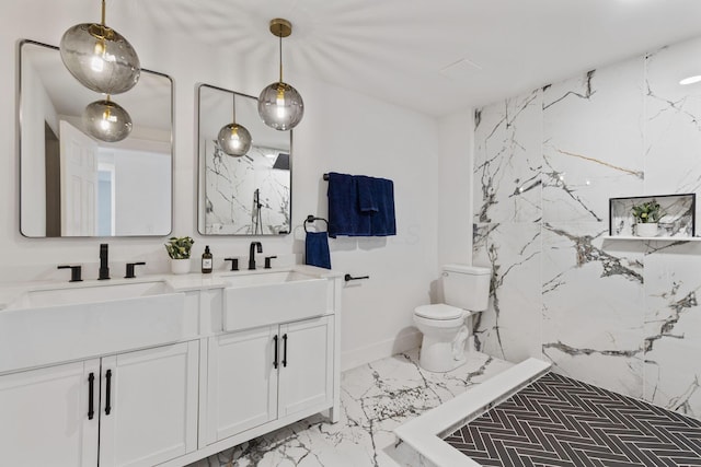 bathroom with vanity, a shower, and toilet