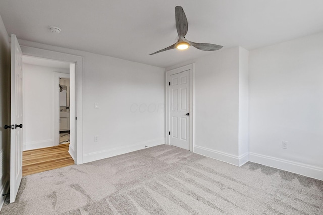 unfurnished bedroom featuring ceiling fan and carpet